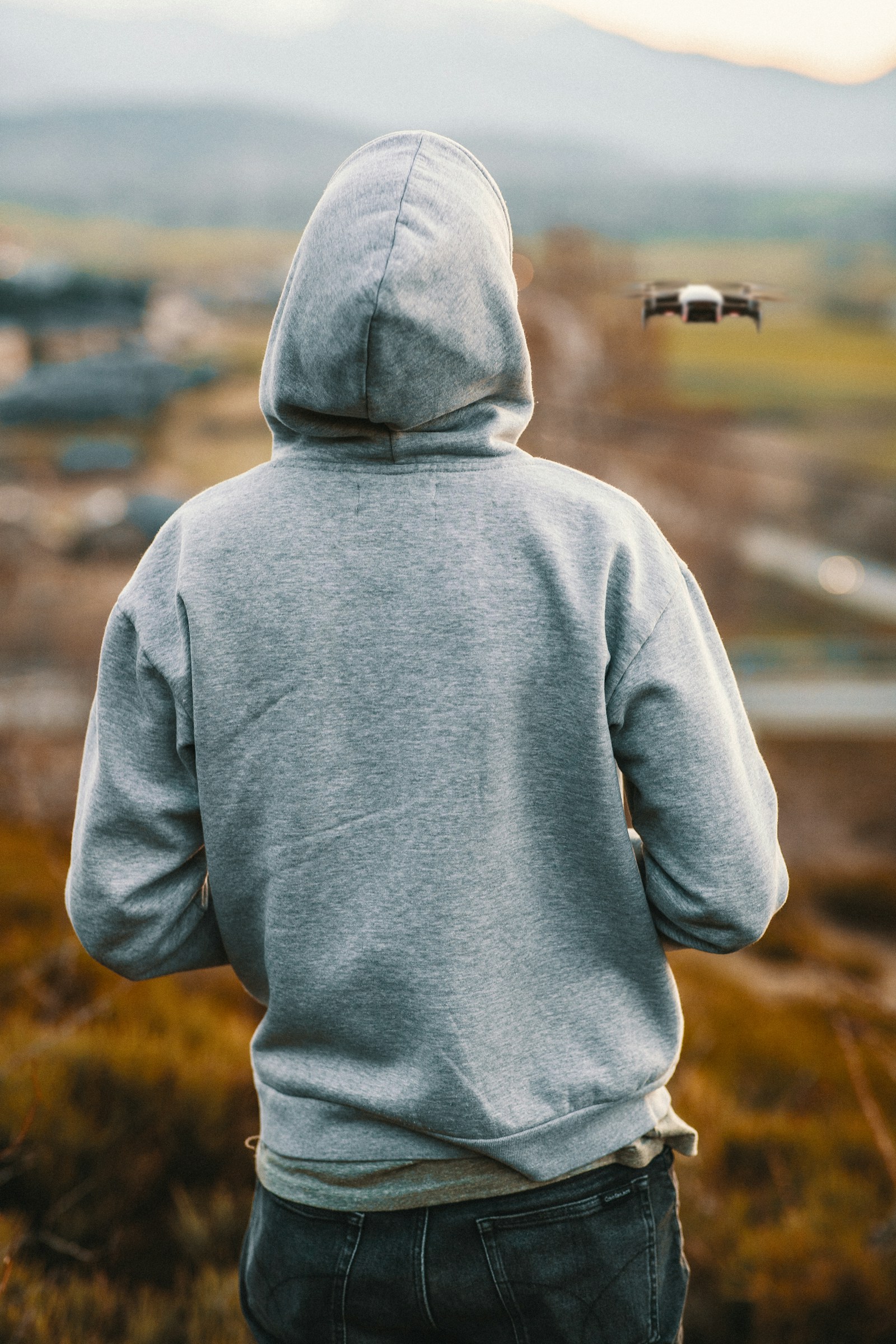 Grey hoodie and relaxed everyday menswear styling