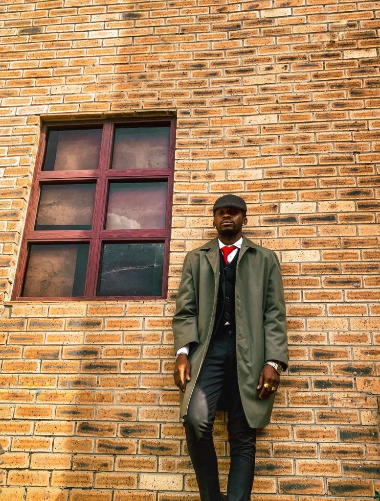 Man wearing a classic tailored coat, illustrating a timeless winter overcoat outfit